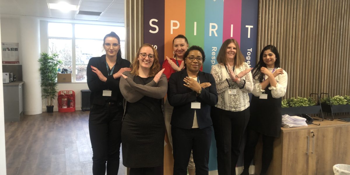 The Derwent FM team of women standing in front of the values sign sharing their support for international women's day with the breakthebias pose - arms in an cross shape