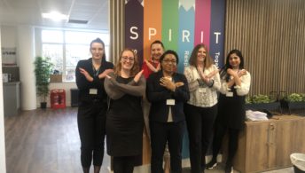 The Derwent FM team of women standing in front of the values sign sharing their support for international women's day with the breakthebias pose - arms in an cross shape